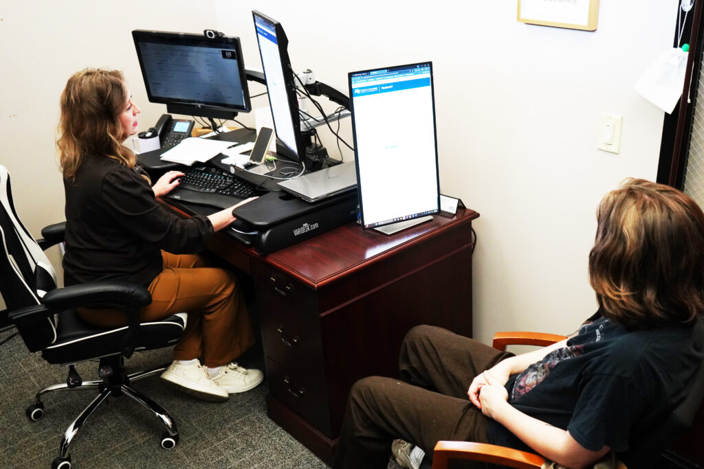 Academic Advisor meets with student to schedule classes for upcoming semester